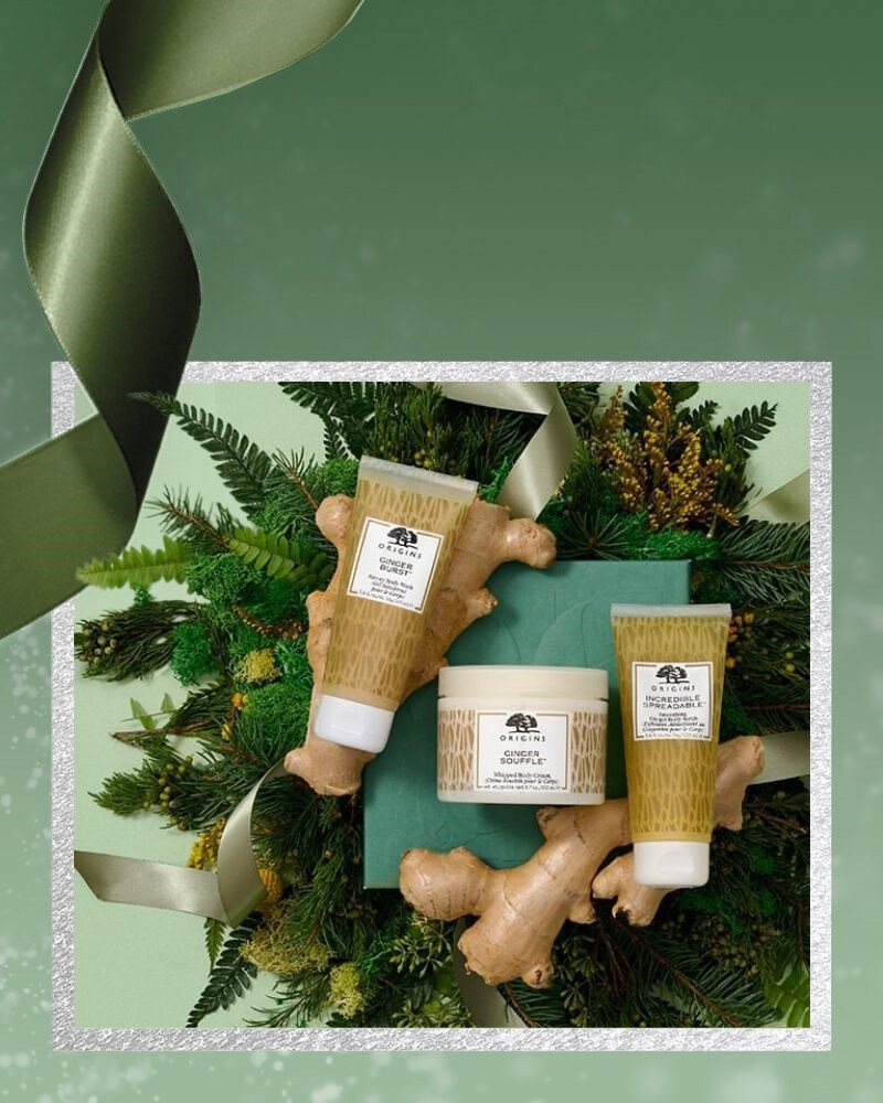 Origins souffle sampler holiday set with green festive background